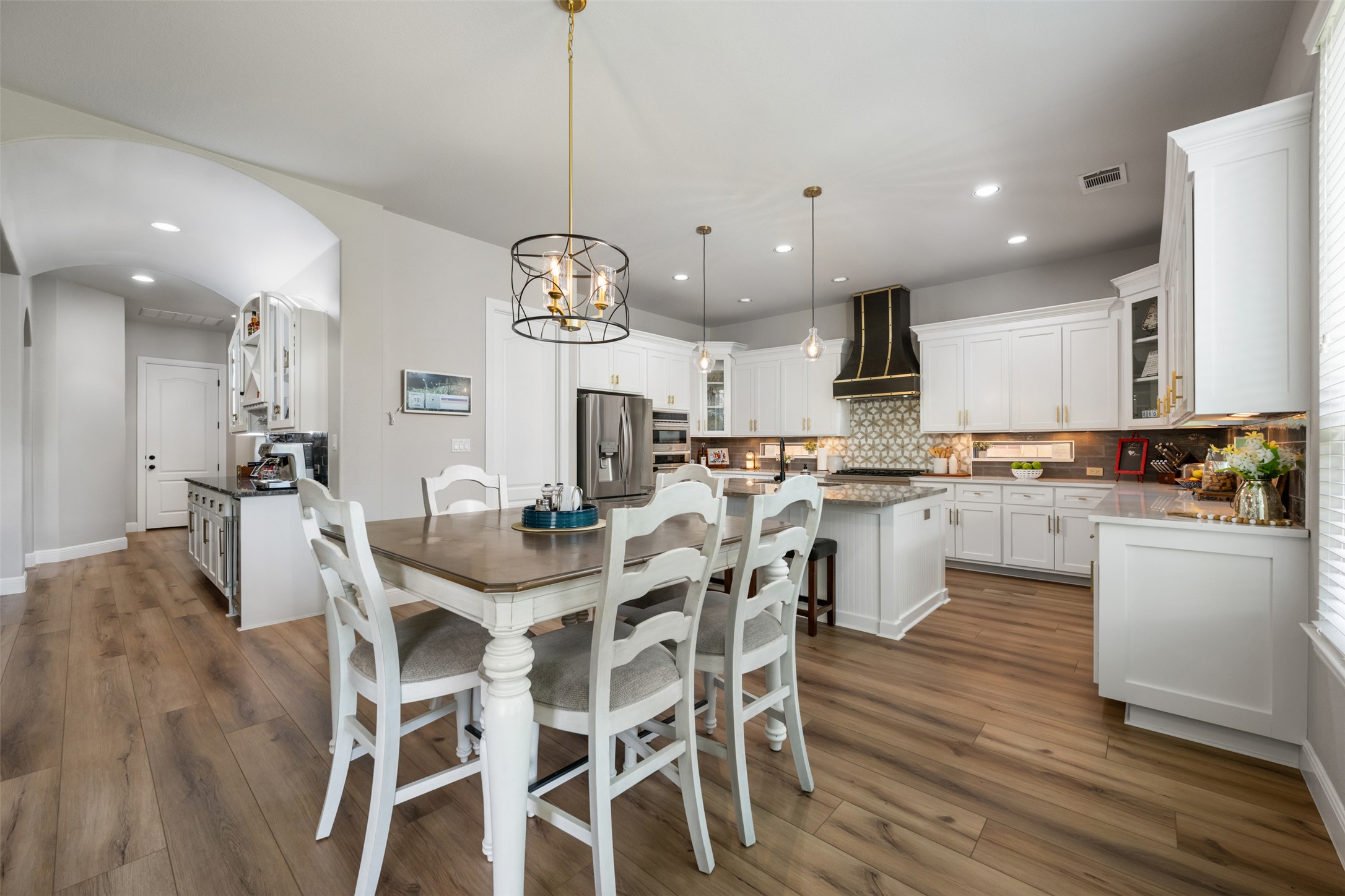 3021 Wedgescale Pass Leander, TX 78641 - Photo 8 of 40 a large kitchen with a table and chairs