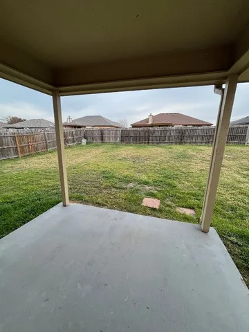 a view of a field with an ocean view