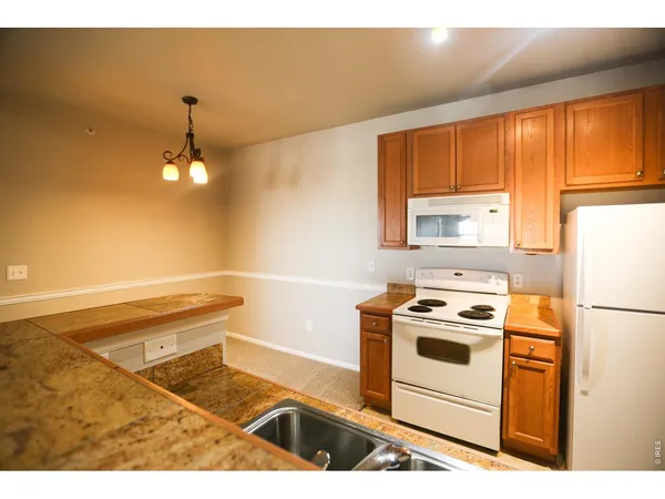 a view of a kitchen with a sink