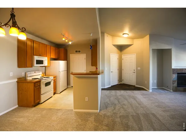 a kitchen with a stove and a microwave