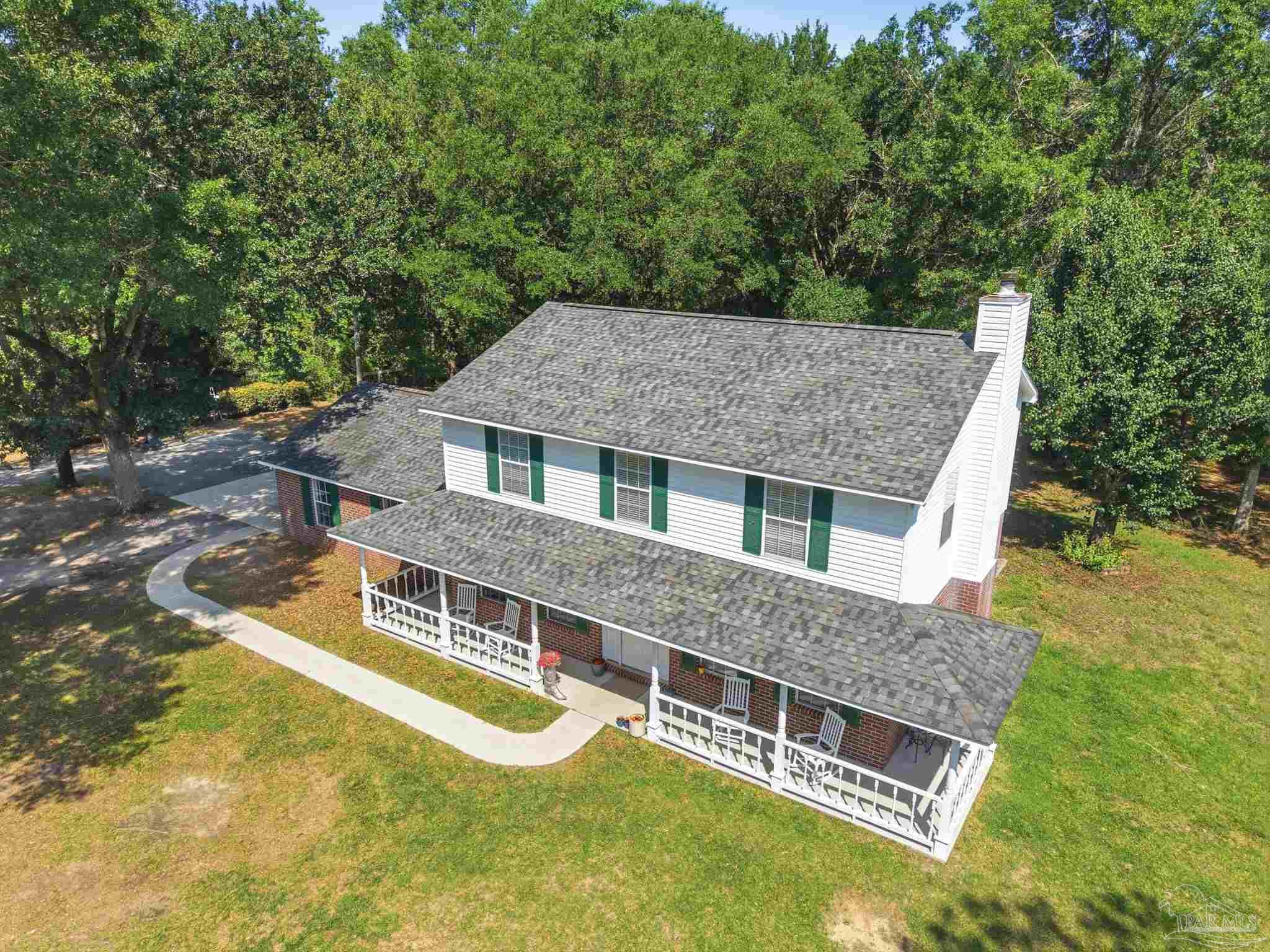 6870 Martin Road Milton, FL 32570 - Photo 4 of 48 aerial view of a house with pool