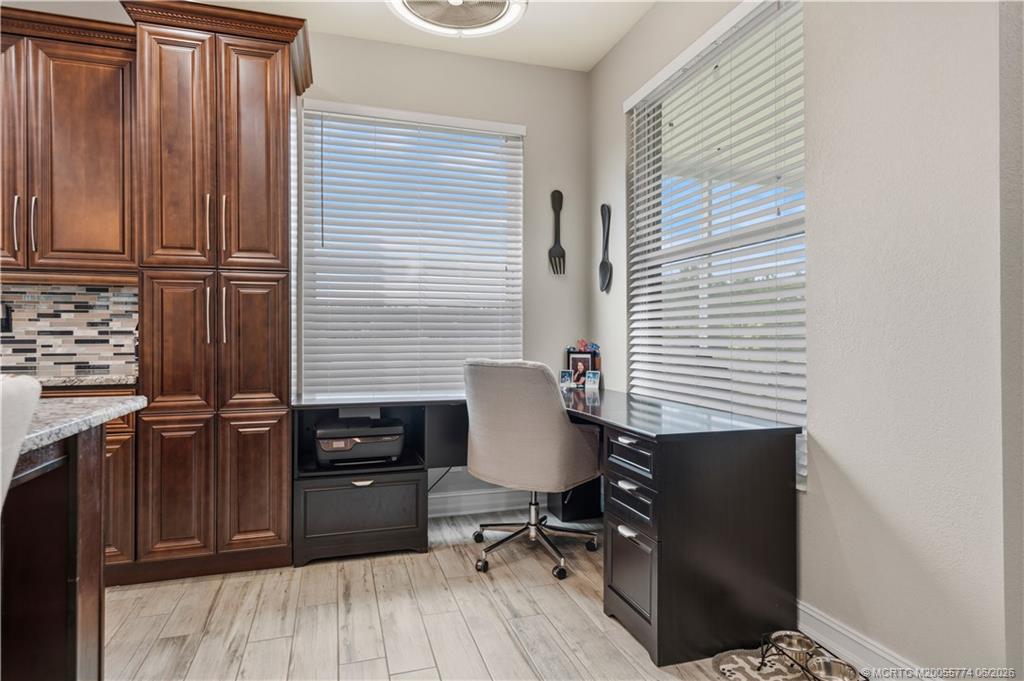 1268 Southeast Kirk Street Stuart, FL 34997 - Photo 27 of 63 a view of workspace with wooden floor