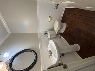 106 Antique Court Pendleton, SC 29670 - Photo 6 of 18 Hardwood flooring complements a clean, functional pedestal sink and toilet in this powder room.