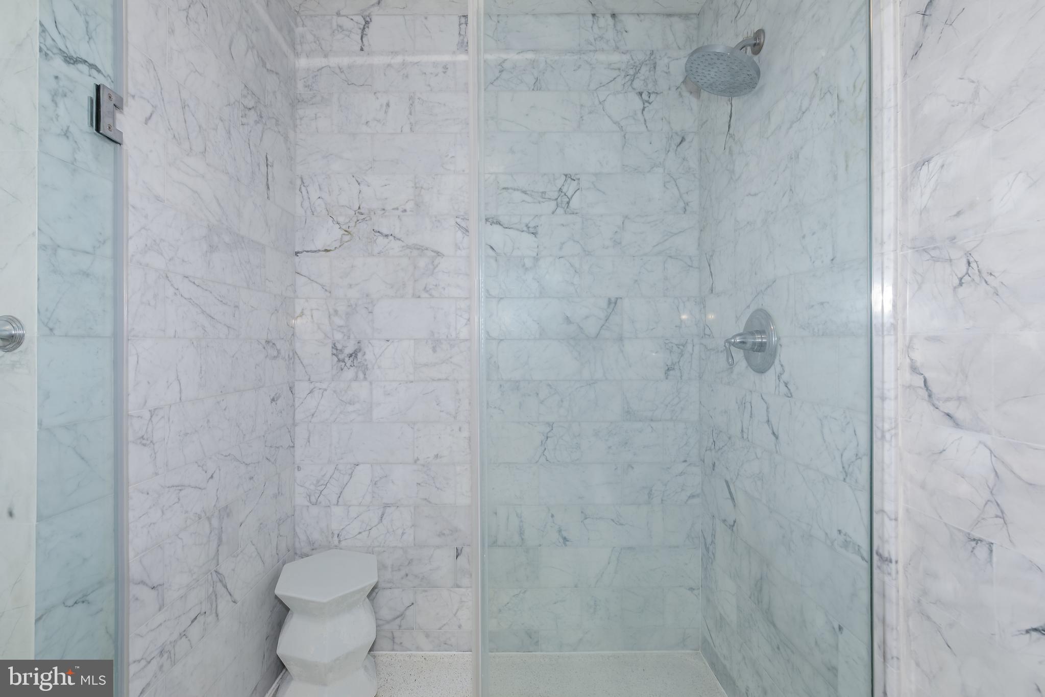 2425 L Street Northwest, Unit 211 Washington, DC 20037 - Photo 22 of 43 a bathroom with a toilet sink and shower