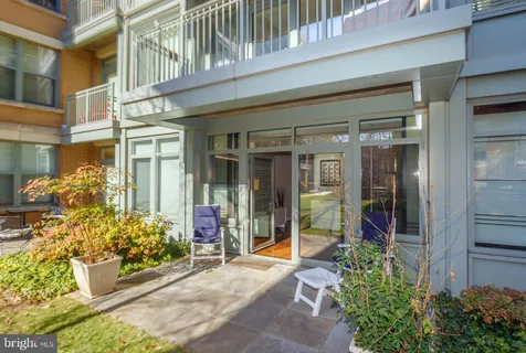 a view of house with outdoor seating area