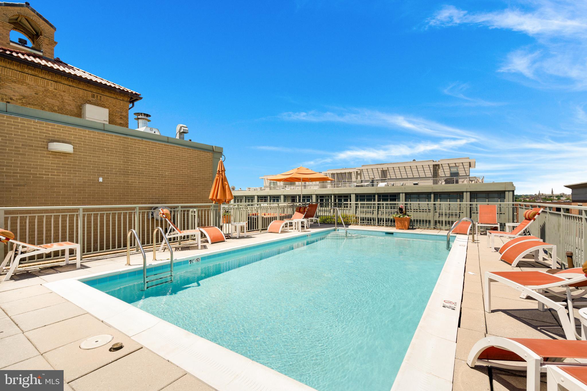 2425 L Street Northwest, Unit 211 Washington, DC 20037 - Photo 28 of 43 a view of a swimming pool with a lounge chair