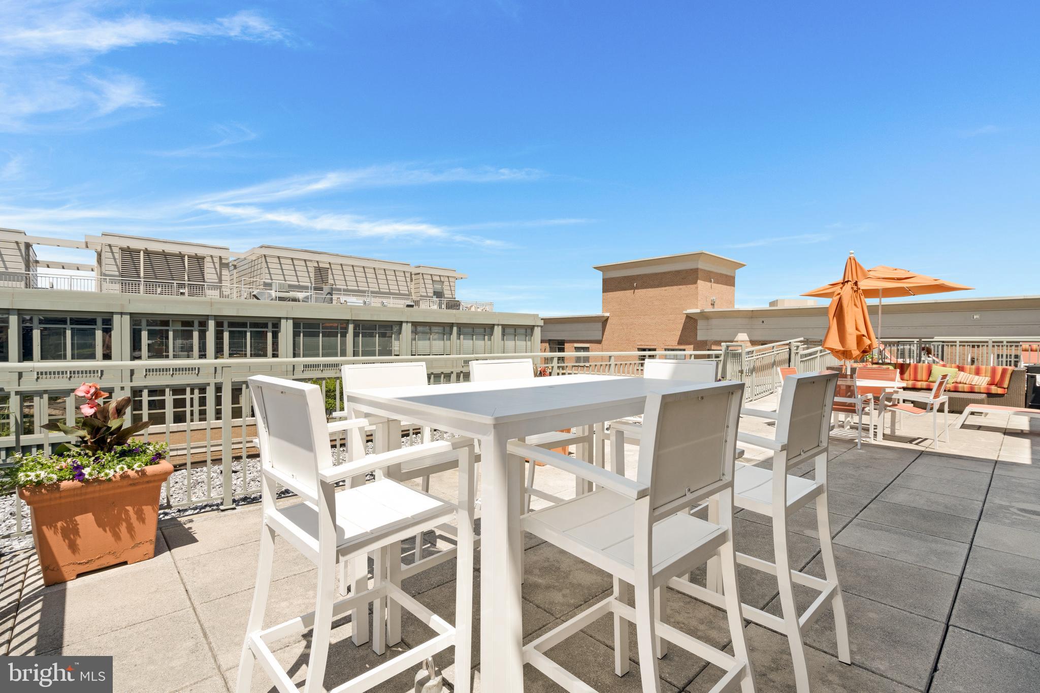 2425 L Street Northwest, Unit 211 Washington, DC 20037 - Photo 29 of 43 a view of a chairs and table in a terrace