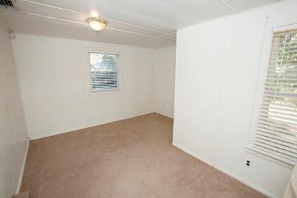 1020 Ellingson Lane, Unit B Austin, TX 78751 - Photo 5 of 6 an empty room with windows