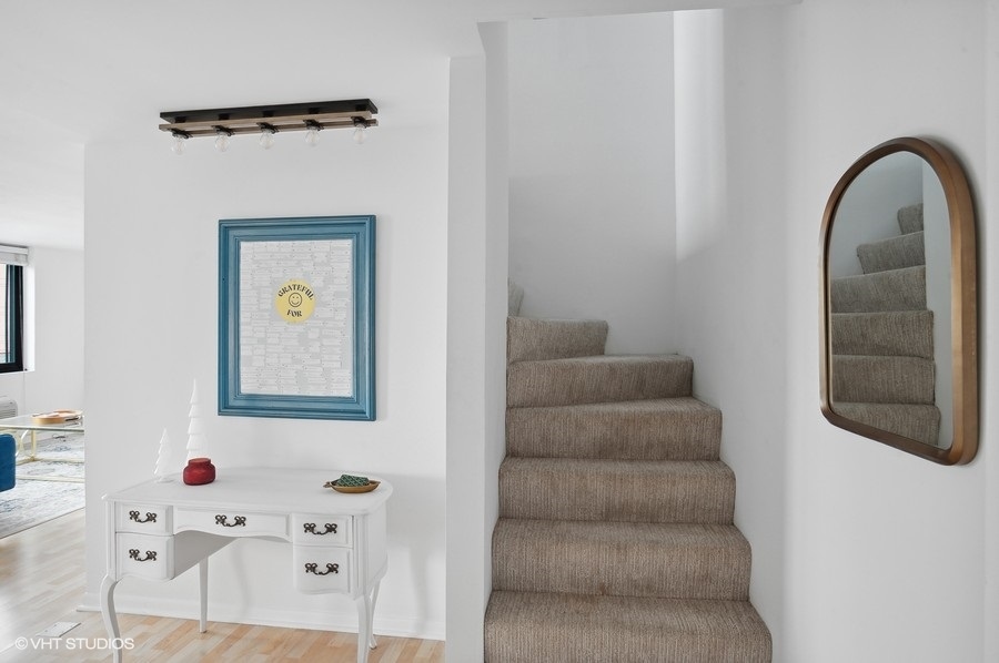 1221 North Dearborn Parkway, Unit PH10N Chicago, IL 60610 - Photo 12 of 23 a view of staircase with white walls