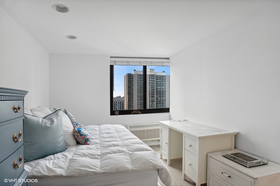 1221 North Dearborn Parkway, Unit PH10N Chicago, IL 60610 - Photo 14 of 23 a bedroom with a bed and a window