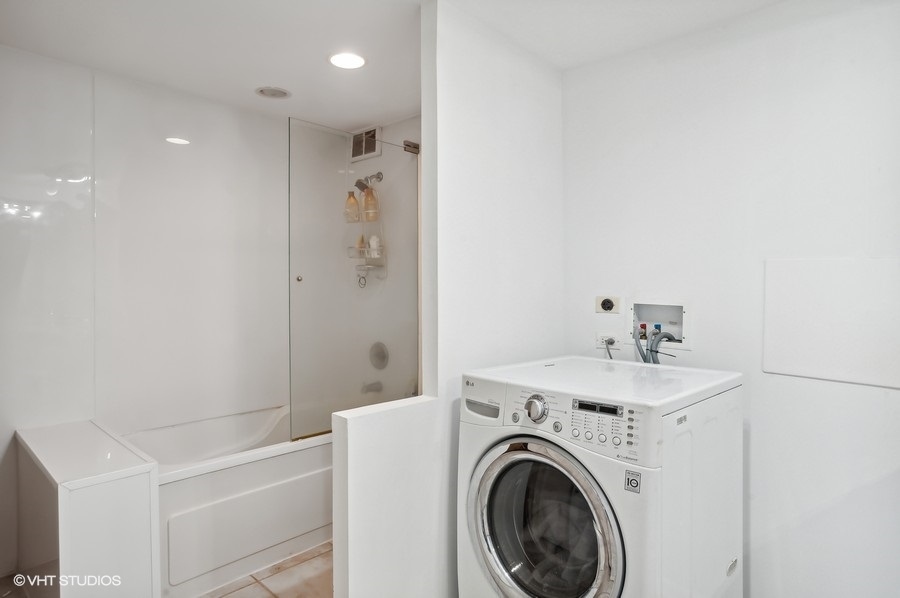 1221 North Dearborn Parkway, Unit PH10N Chicago, IL 60610 - Photo 17 of 23 a view of bathroom with a washer and dryer