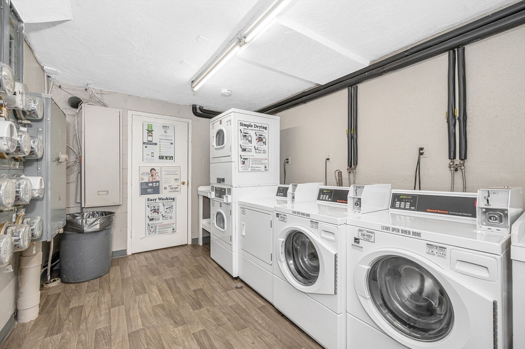 1 Brown Avenue, Unit 380 Amesbury, MA 01913 - Photo 20 of 25 a view of washer and dryer with bathroom in the background