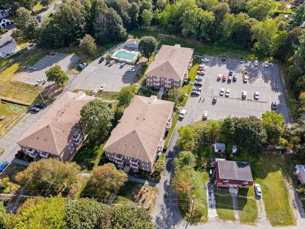1 Brown Avenue, Unit 380 Amesbury, MA 01913 - Photo 22 of 25 an aerial view of a house with a garden