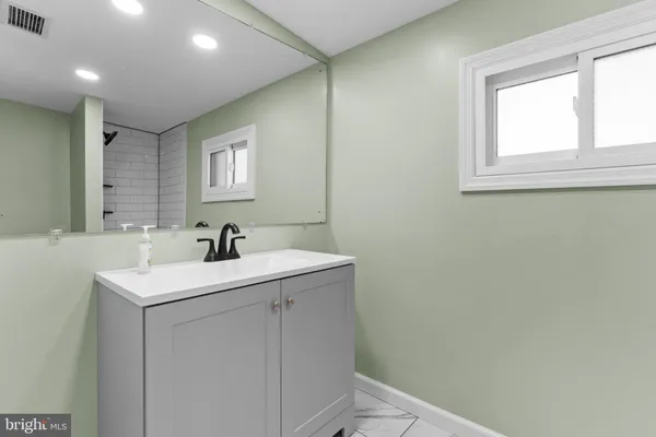 a bathroom with a sink and a toilet