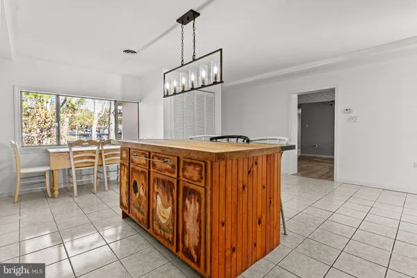 a kitchen with stainless steel appliances granite countertop a stove and a sink