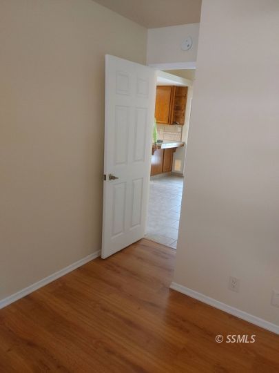 609 East Wilson Avenue Ridgecrest, CA 93555 - Photo 13 of 32 a view of hallway with wooden floor