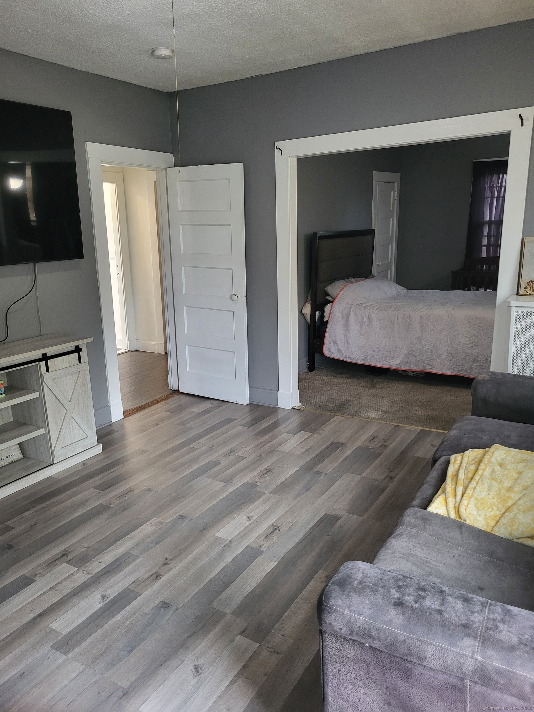 Undisclosed Address Bridgeport, CT 06607 - Photo 4 of 10 a bedroom with a bed and a flat screen tv