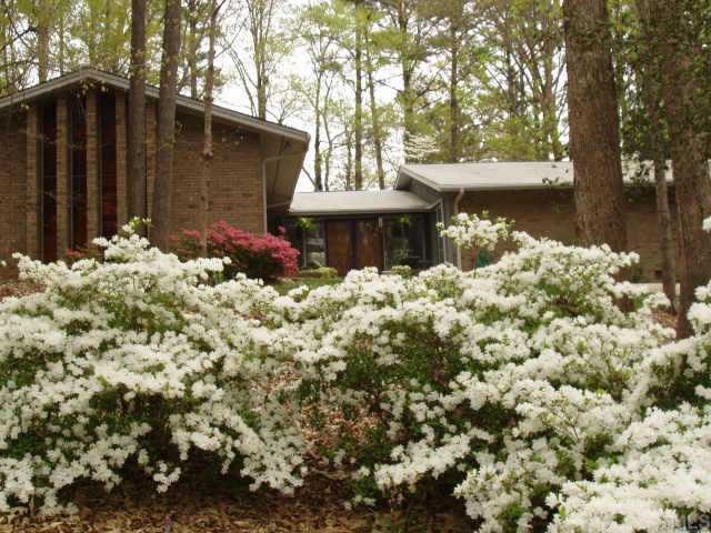 4512 Oak Park Road Raleigh, NC 27612 - Photo 1 of 1 a backyard of a house with table and chairs