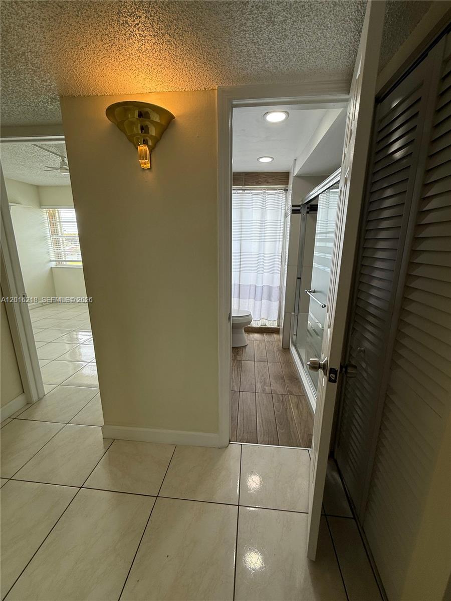9321 Southwest 4th Street, Unit 230C Miami, FL 33174 - Photo 24 of 37 a bathroom with a shower