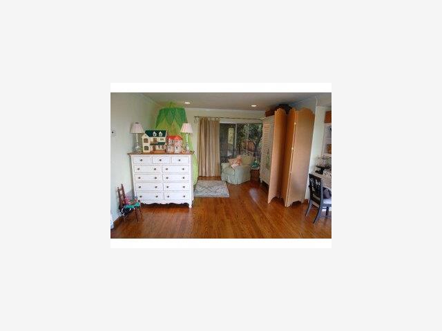 893 Madonna Way Los Altos, CA 94024 - Photo 4 of 8 a hallway with a large mirror and a potted plant