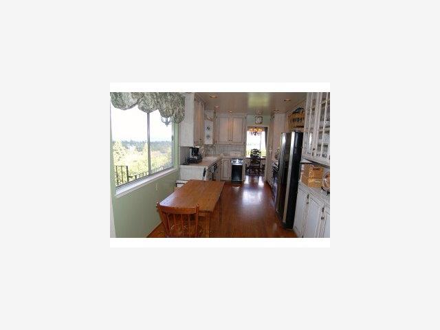 893 Madonna Way Los Altos, CA 94024 - Photo 5 of 8 a living room with furniture and large windows