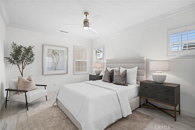 a bedroom with double bed and a window