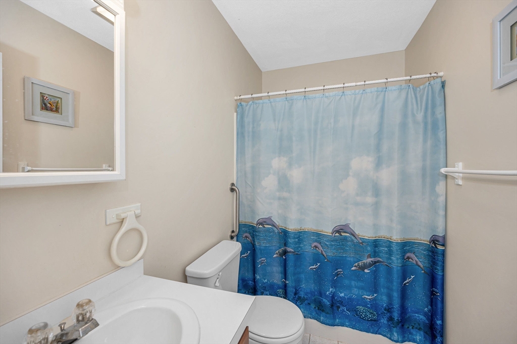 39 Broadway, Unit 305 Malden, MA 02148 - Photo 27 of 36 a bathroom with a sink toilet and shower