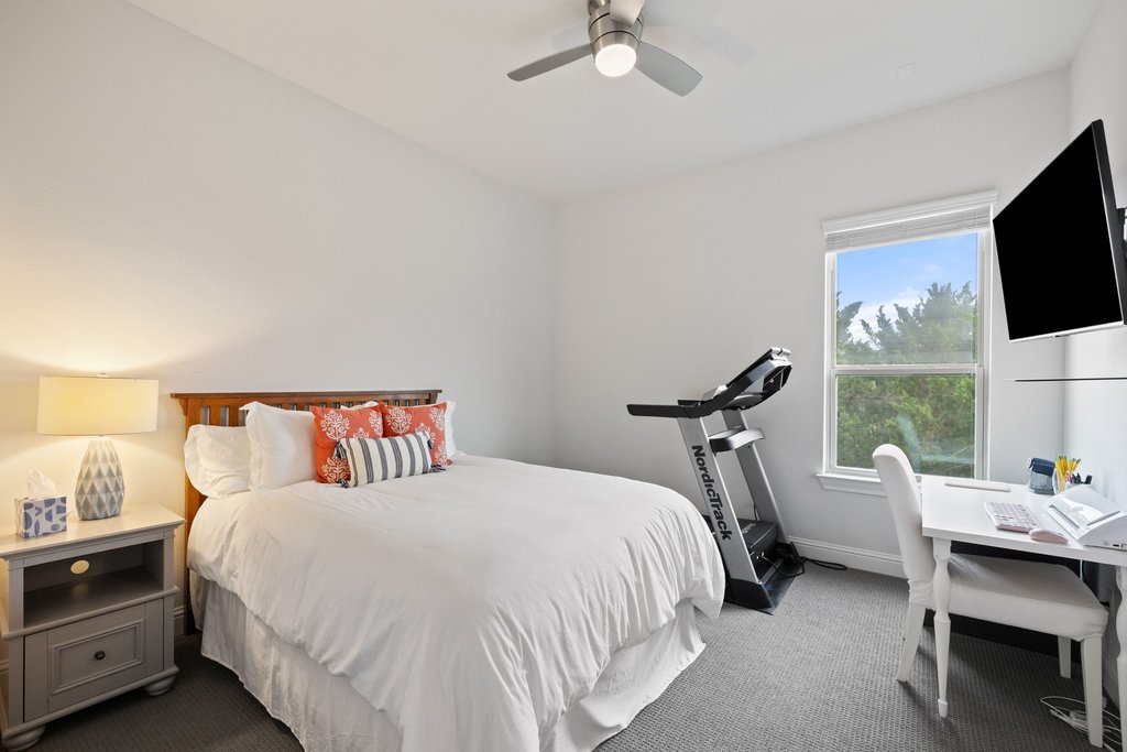 215 Lodestone Lane Austin, TX 78738 - Photo 25 of 40 A quiet bedroom offers an ideal blend of rest and productivity.