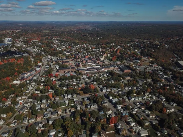 an aerial view of residential houses with city view