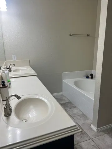 a bathroom with a sink and washing machine