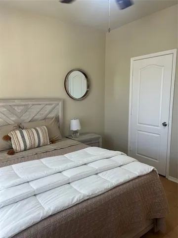 a bedroom with a bed and cabinets