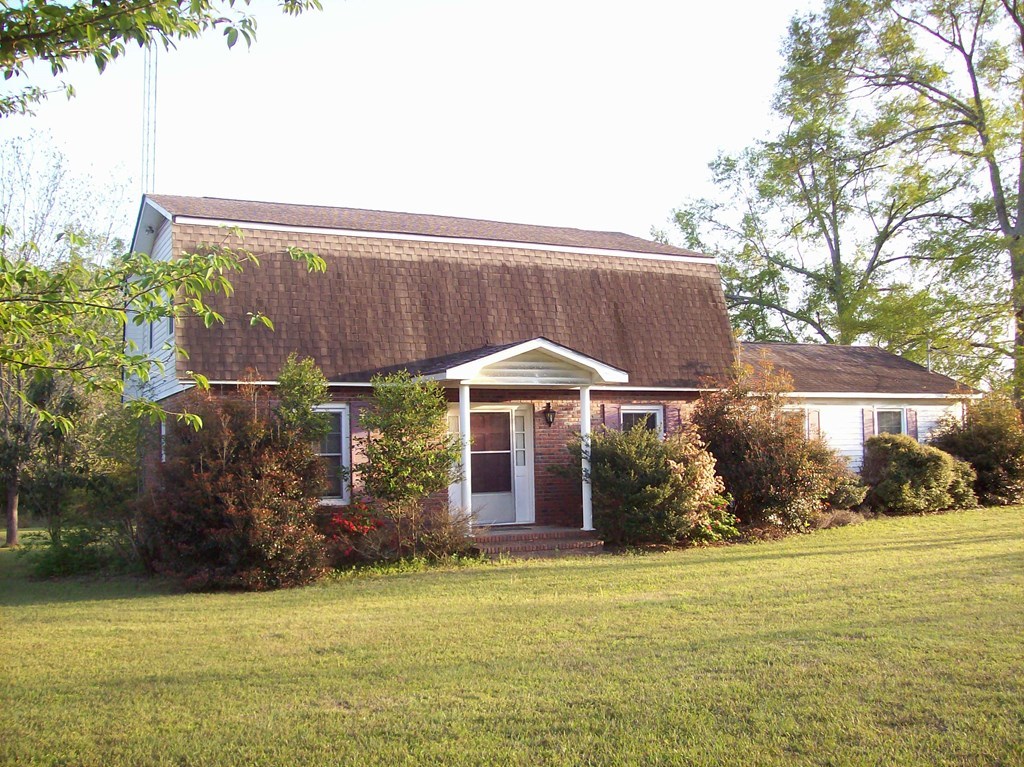 236 Chambers Road Macon, GA 31217 - Photo 2 of 29 a backyard of a house with yard and outdoor seating