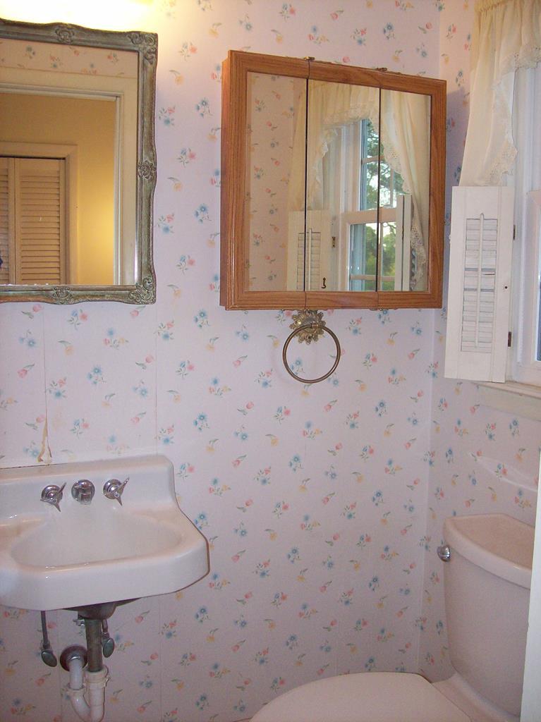 236 Chambers Road Macon, GA 31217 - Photo 11 of 29 a bathroom with a sink a toilet and a mirror