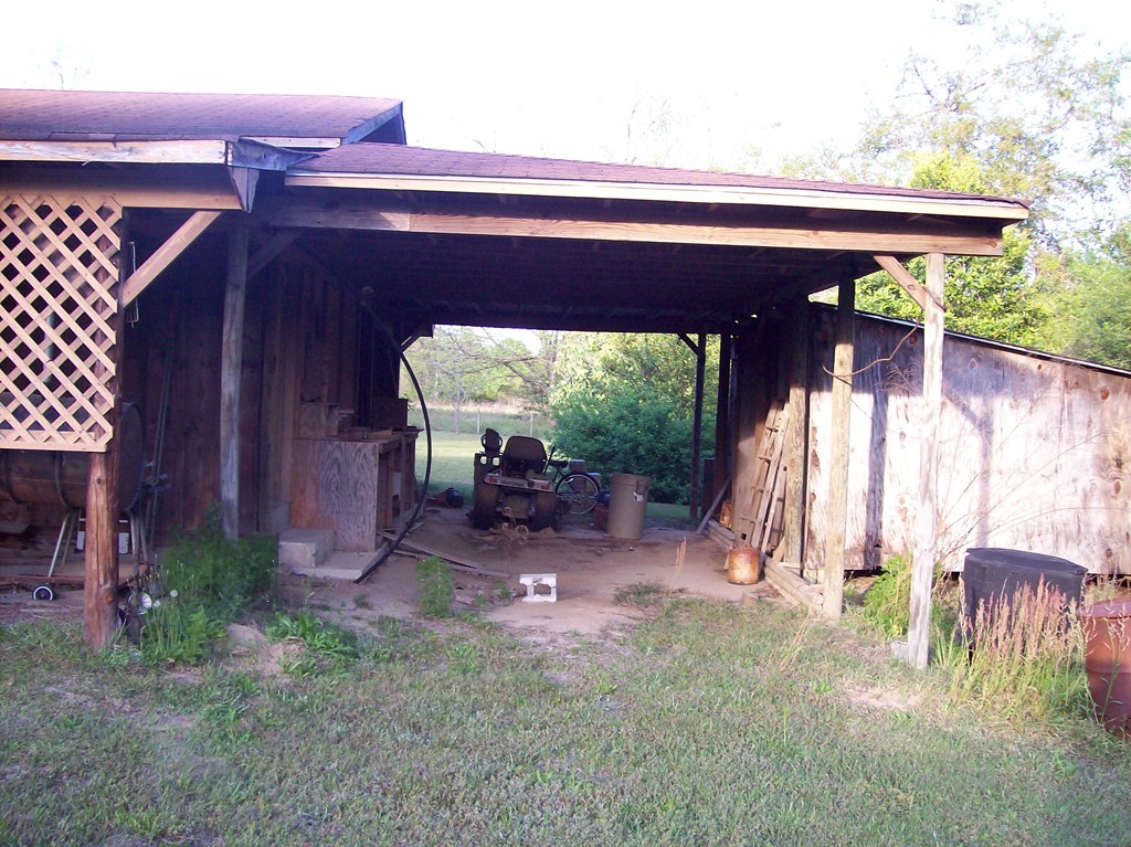 236 Chambers Road Macon, GA 31217 - Photo 25 of 29 a view of backyard with a table and chairs under an umbrella