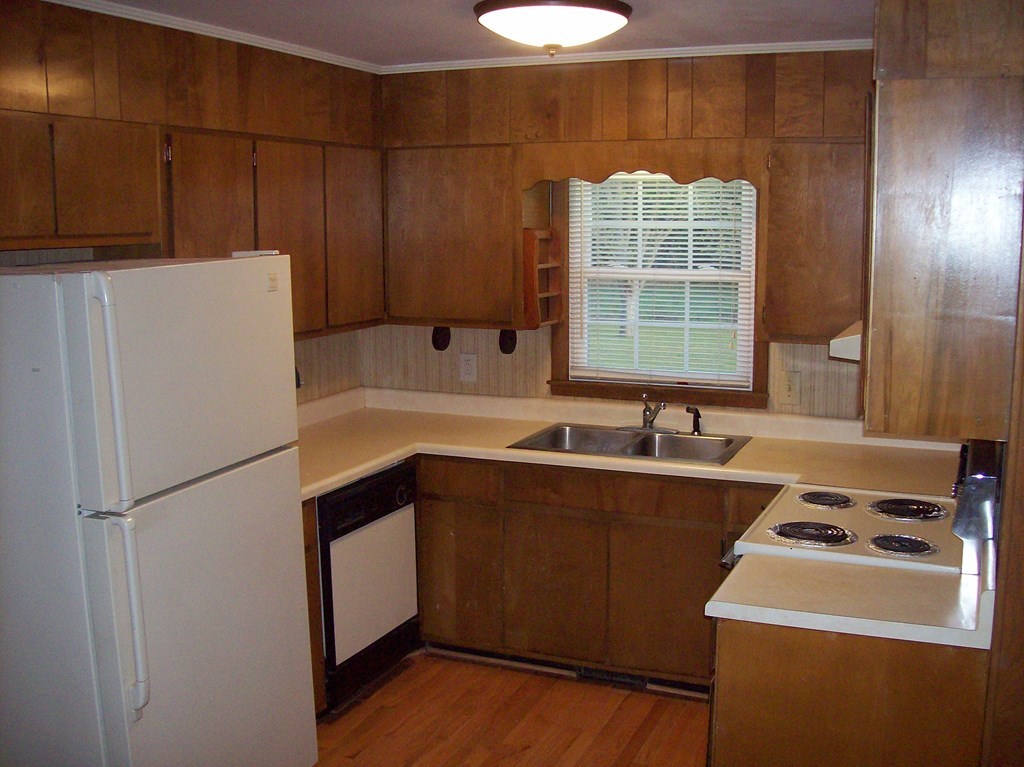 236 Chambers Road Macon, GA 31217 - Photo 4 of 29 a kitchen with a refrigerator and a sink