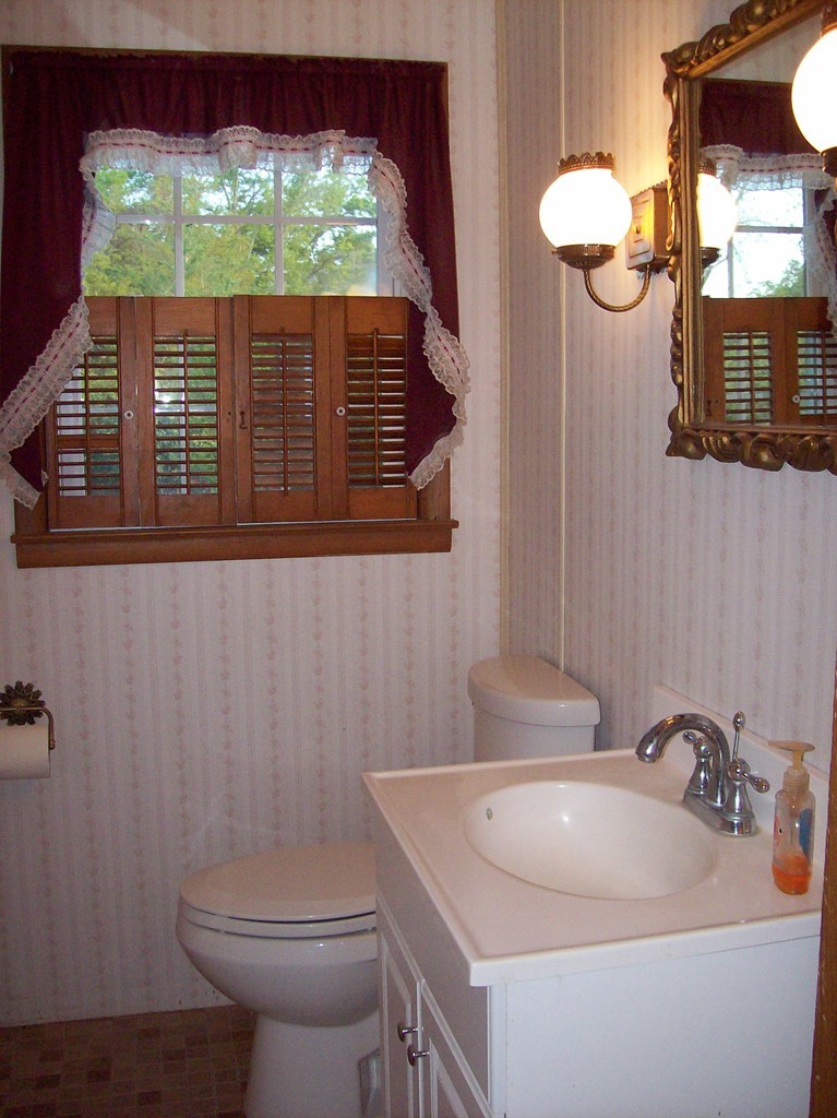 236 Chambers Road Macon, GA 31217 - Photo 8 of 29 a bathroom with a sink a toilet and mirror