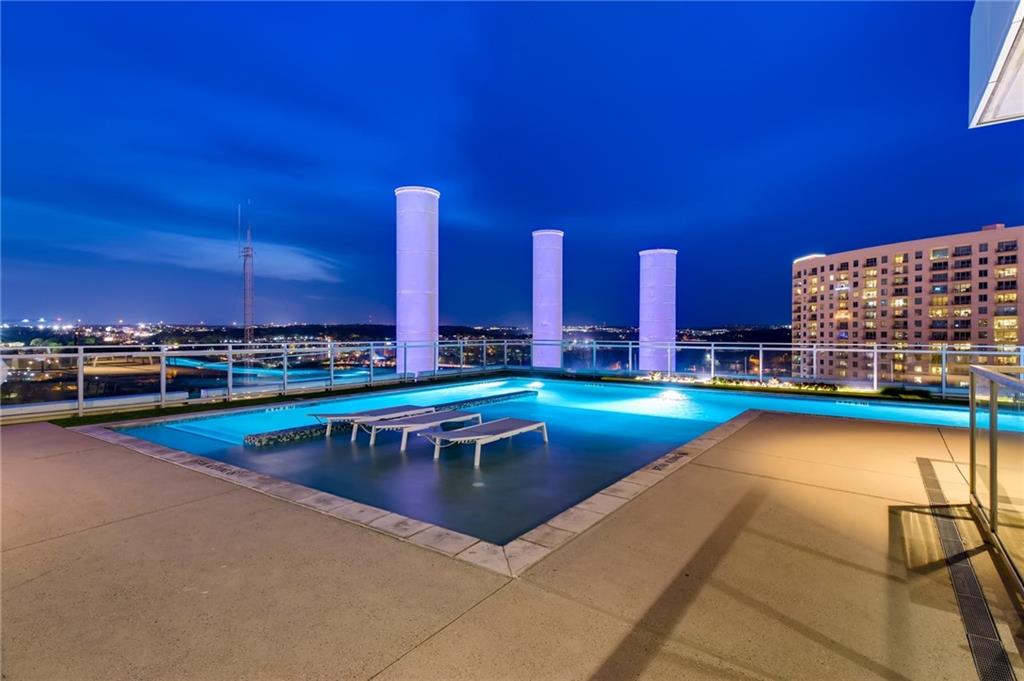 222 West Avenue, Unit 2207 Austin, TX 78701 - Photo 24 of 30 Rooftop swimming pool featuring underwater lighting and integrated lounge seating