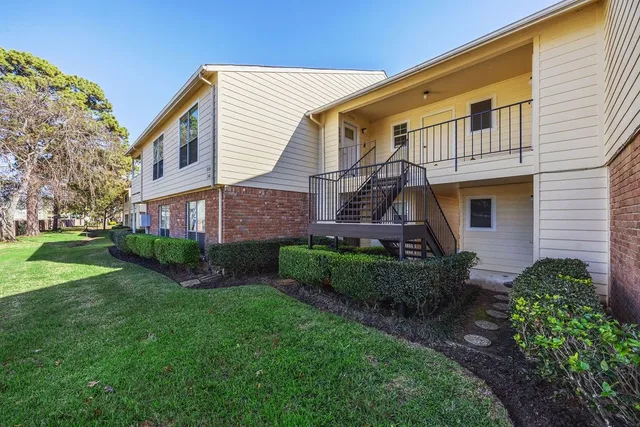 a house view with a garden space