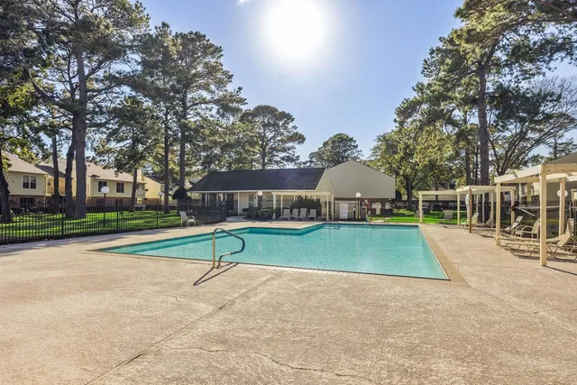 a view of a park with a tree in the background