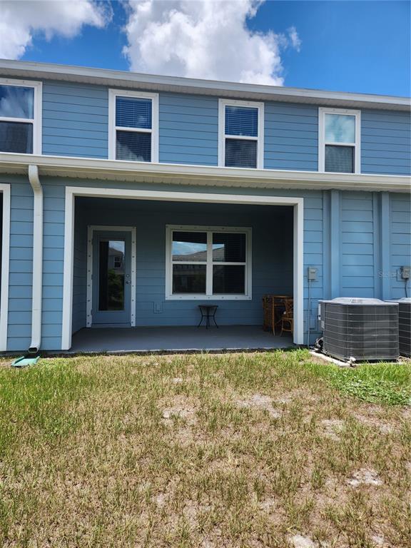 12003 Grizzly Lane New Port Richey, FL 34654 - Photo 42 of 43 a view of a house with a yard