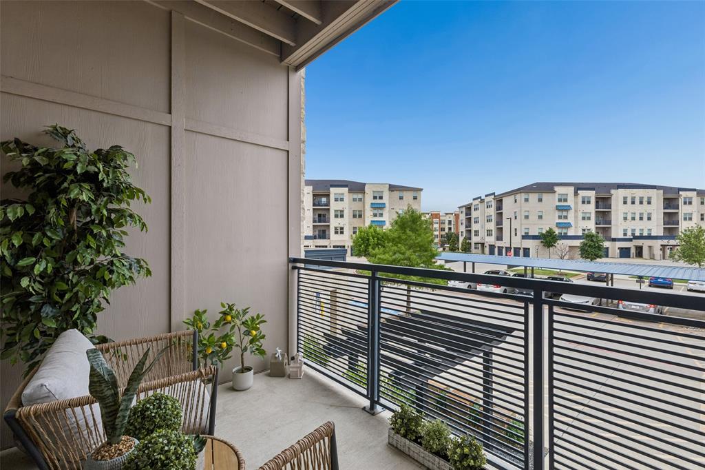 651 Watters Road, Unit 7204 Allen, TX 75013 - Photo 2 of 40 a city view from a balcony