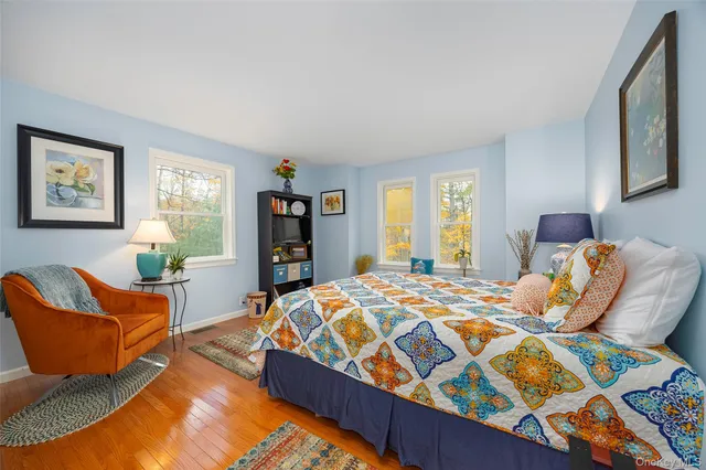 a bedroom with a bed and a couch