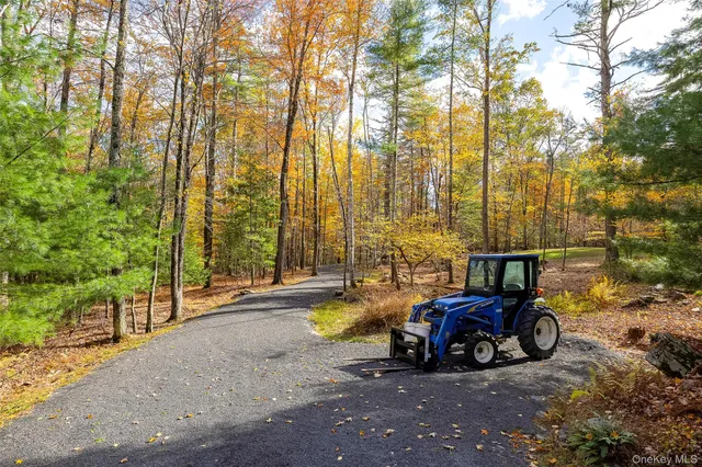 a view of a car is parked in front of the house