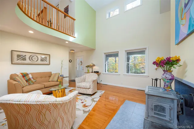 a living room with furniture and a potted plant