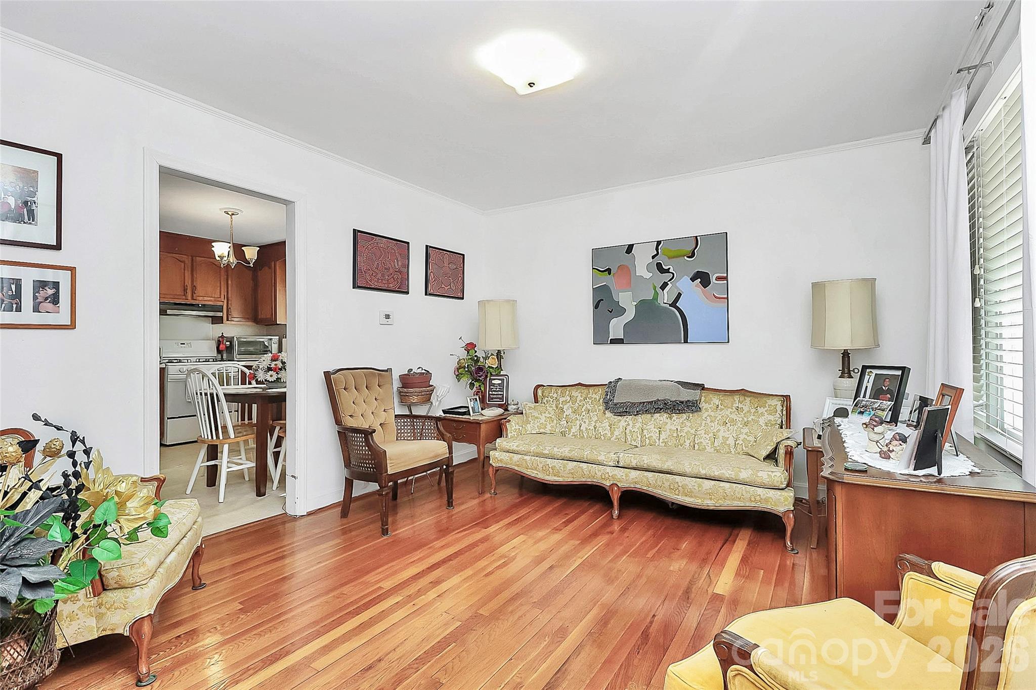 326 North Alexander Street Mount Holly, NC 28120 - Photo 3 of 11 a living room with furniture and a wooden floor