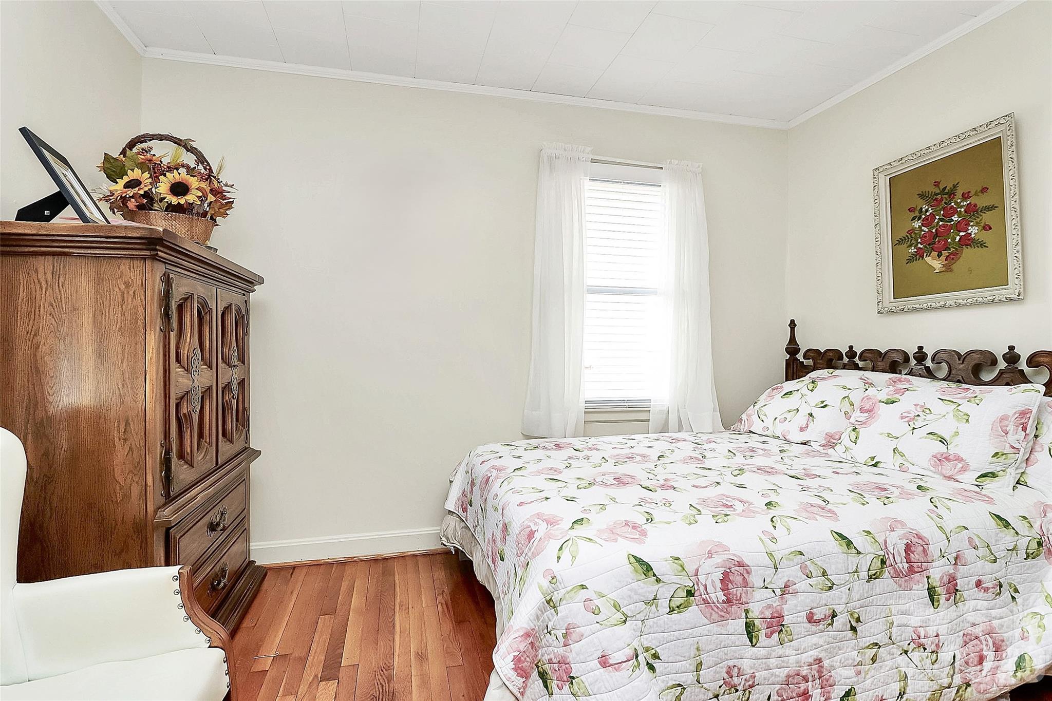 326 North Alexander Street Mount Holly, NC 28120 - Photo 7 of 11 a bedroom with a bed and a window