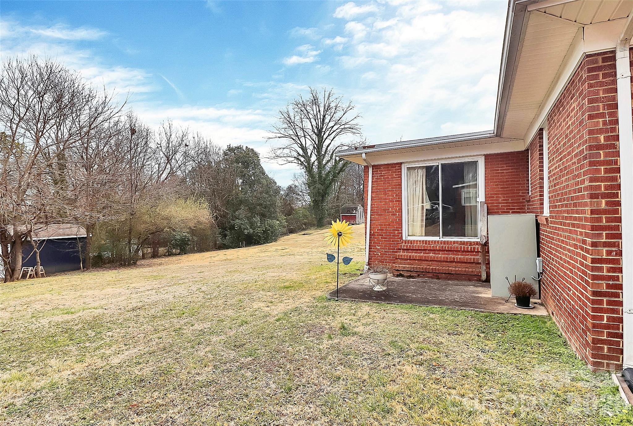 326 North Alexander Street Mount Holly, NC 28120 - Photo 10 of 11 a view of a house with a yard