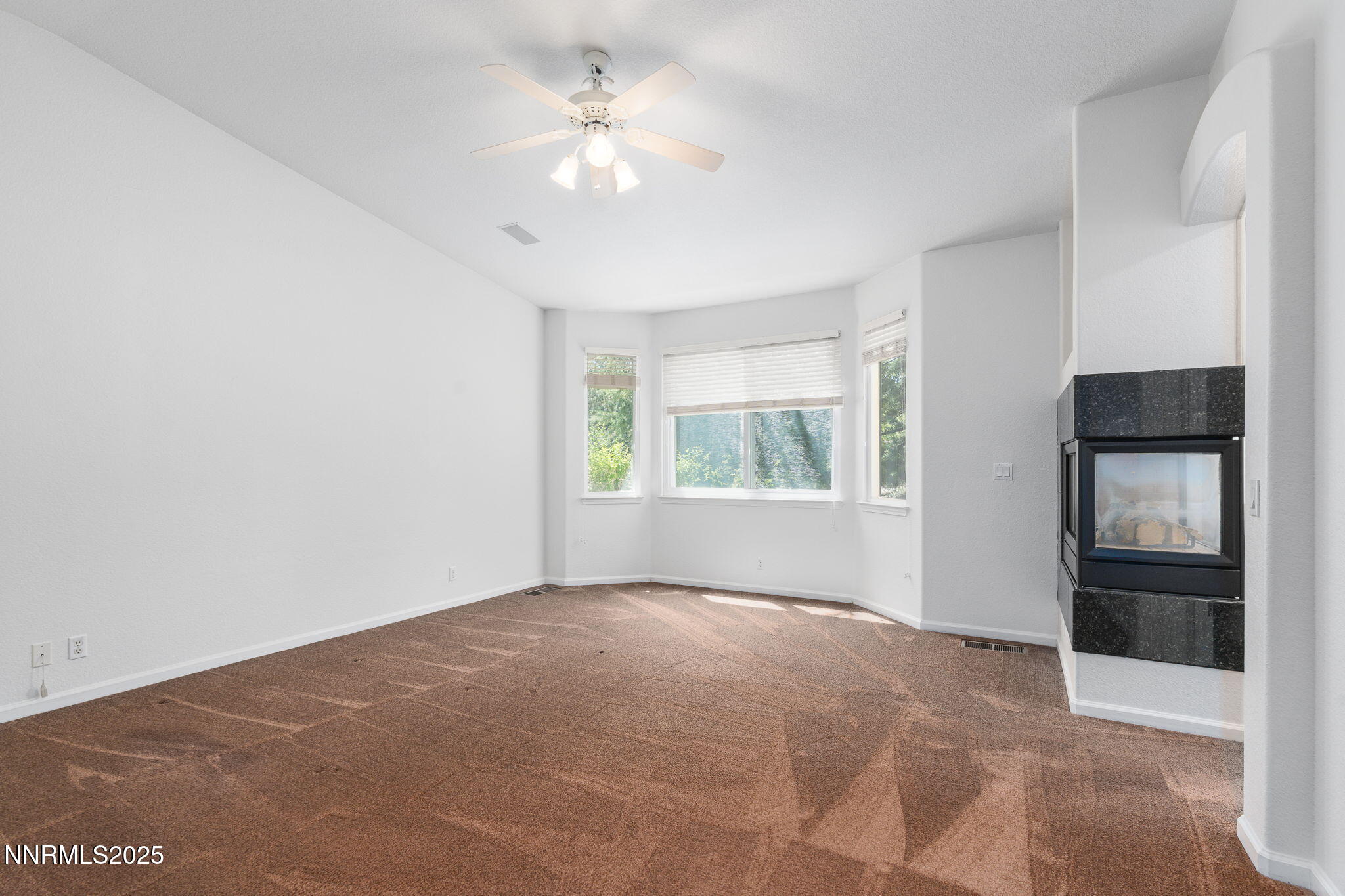 1300 Flanders Road Reno, NV 89511 - Photo 11 of 46 an empty room with windows and closet
