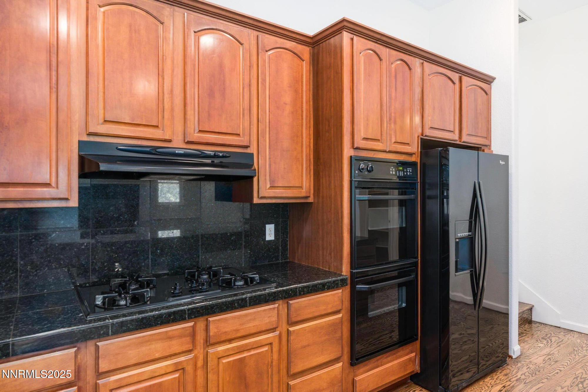 1300 Flanders Road Reno, NV 89511 - Photo 15 of 46 a kitchen with stainless steel appliances a refrigerator and cabinets