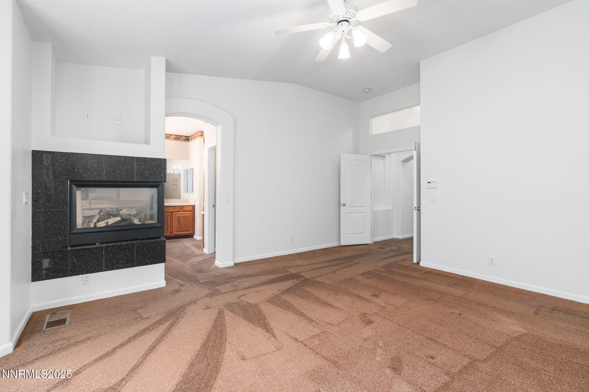1300 Flanders Road Reno, NV 89511 - Photo 19 of 46 a view of an empty room with a fireplace